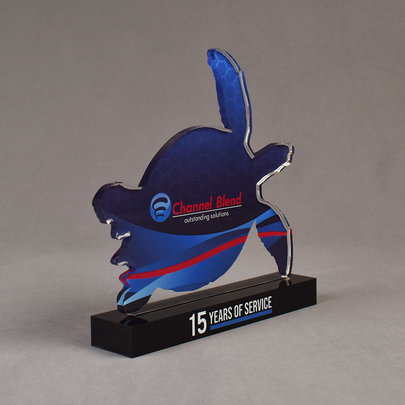Turtle shaped acrylic award with full color ClearChanel logo with blue background.